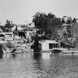 Grays Point looking from Mansion Bay with view of boatshed and vacation homes facing the water, ca. 1920s