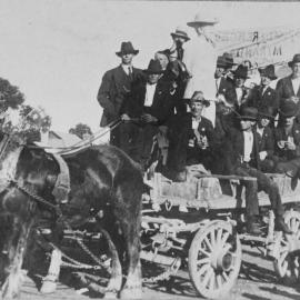 Soldier statue from Miranda Public School War Memorial and group of men in a horse-drawn wagon, ca. 1921