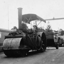 Tom Ugly's steam punt loading and unloading a steam roller, ca. 1920s