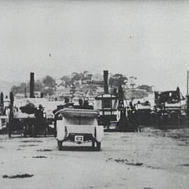 Steam punt loaded with automobiles approaching Tom Ugly's Point, 1910.