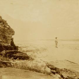 Two men on Cronulla Beach looking north