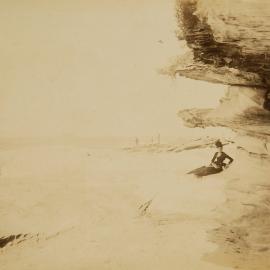 Woman sitting on rock shelf at Cronulla Beach
