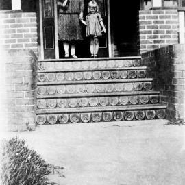 Brinsley residence at 102 Toronto Parade, Sutherland, with lady and girl standing on front steps, ca. 1930s