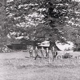 Four men standing with the first car to run from Cronulla to Kurnell, ca. 1927