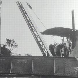 Tom Ugly's Bridge under construction, steel girder being lifted by crane, ca. 1920s
