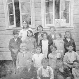 Kurnell Public School students and teachers with view of the schoolhouse, ca. 1921