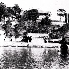 Gunnamatta Bay, view of boatsheds and residence along the shore, ca. 1900s