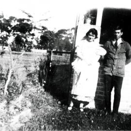 Henry James Junior and Muriel Richards, with baby Ray, outside house, ca. 1925