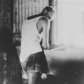 Bill Phelps in the laundry of a house in Avenel Road, Gymea