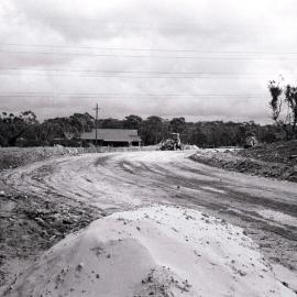 Earth moving machinery working on road near Yates Road, Bangor, ca. 1970s