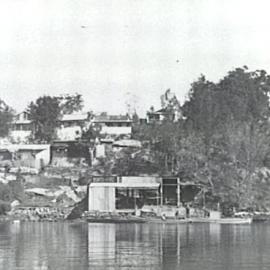 Grays Point looking from Mansion Bay with view of boatshed and vacation homes facing the water, ca. 1920s