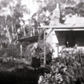 Mrs Yeo at the side of the family house, Menai, ca. 1970