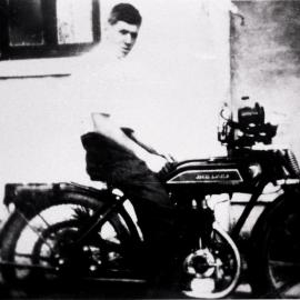 Doug Archer of Menai sitting on a motorcycle, ca. 1920