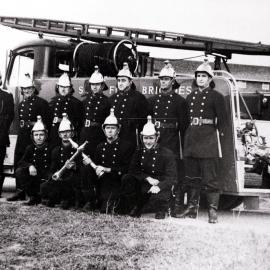 Fire fighters in front of new fire engine