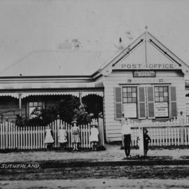 Post Office and Postmaster's residence at Sutherland, with group of children out front; ca. 1900.