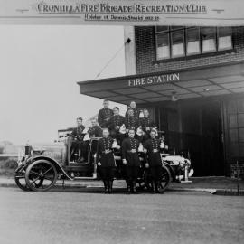 Cronulla Fire Brigade members with their fire engine outside the station
