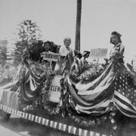Procession from Sutherland to Cronulla Beach for the combined hospital auxilaries carnival featuring the Caringbah float, 1945