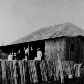 The Anchorage, Croyden Street, Cronulla with members of the Laycock family standing on the front porch