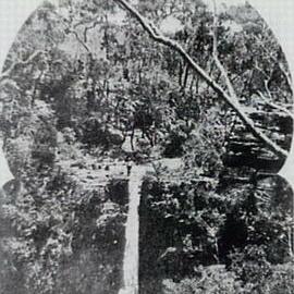 Kelly's Falls near Helensburgh, view of man watching the water cascade down, ca. 1905